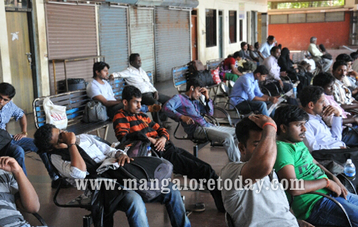 MLA JR Lobo distributes food to stranded passengers in Mangalore